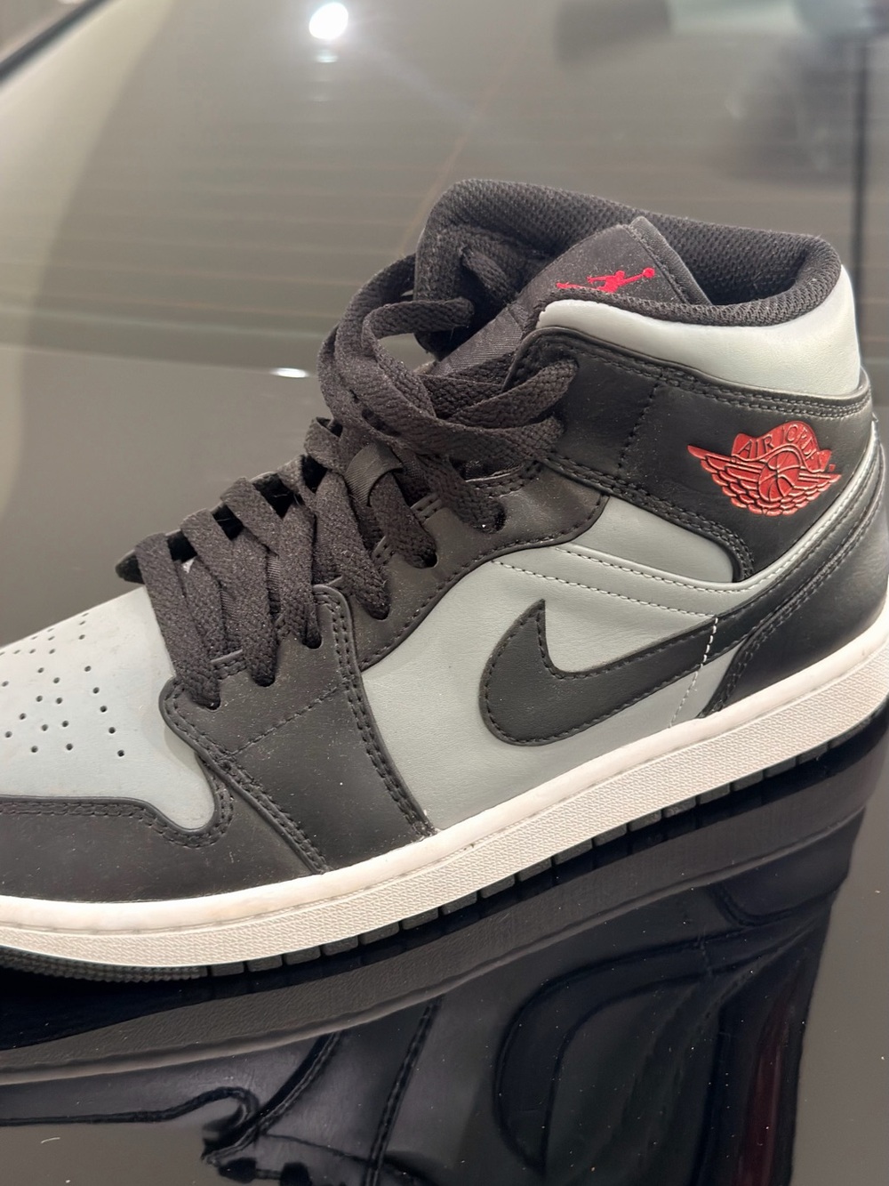 Jordan 1 Mid Sneakers — Black, Light Gray & Red Accents